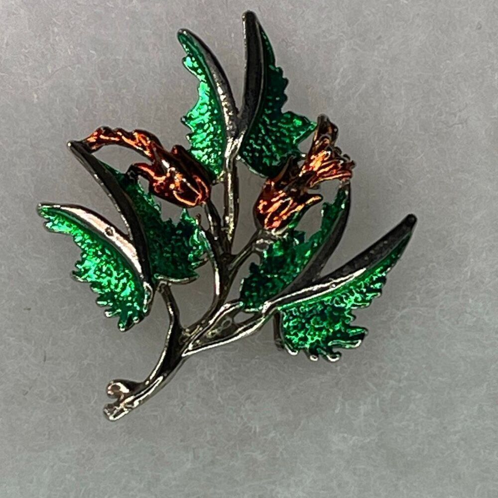 Vintage enamelโfloral Taiwan silver tone brooch.